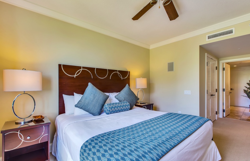 The second master bedroom offers a king-size bed