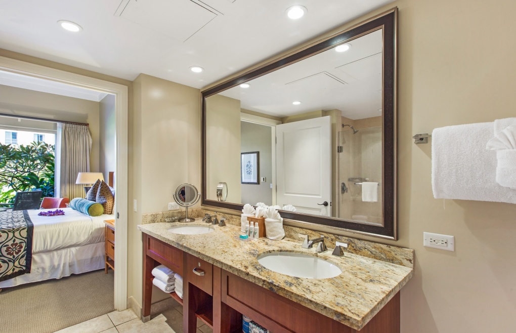 The master bath features a double granite vanity