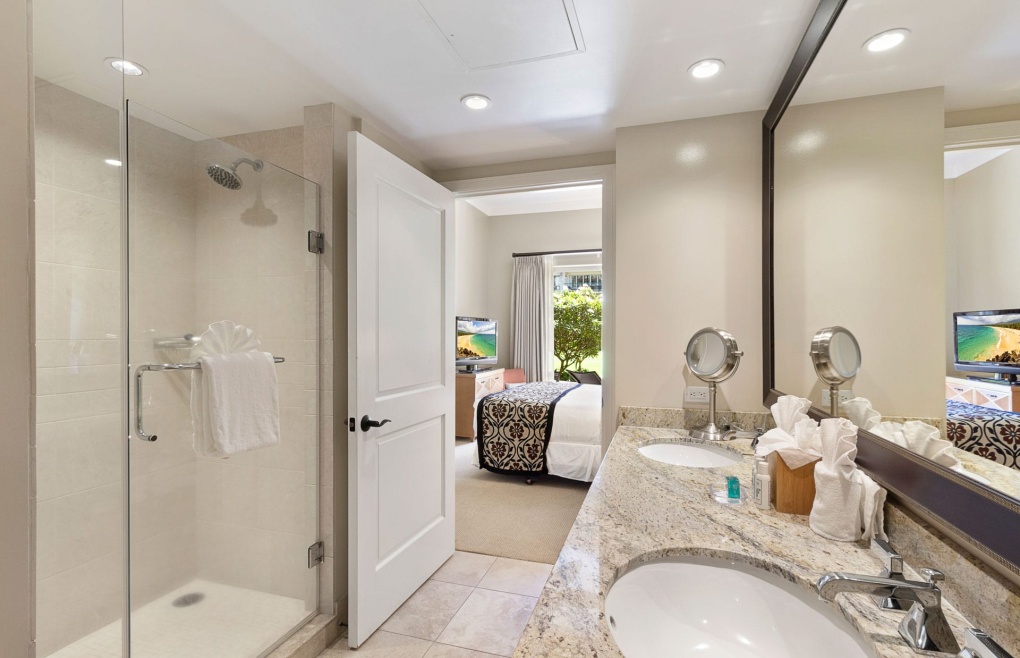 With a glass walk-in shower and soaking tub