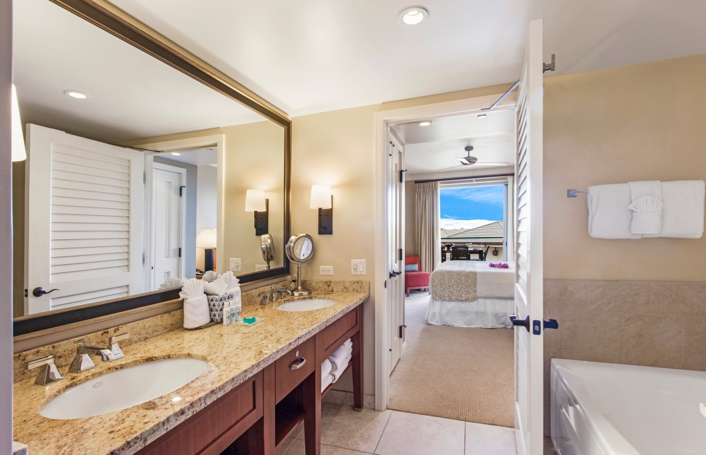 The master bathroom offers a double granite vanity