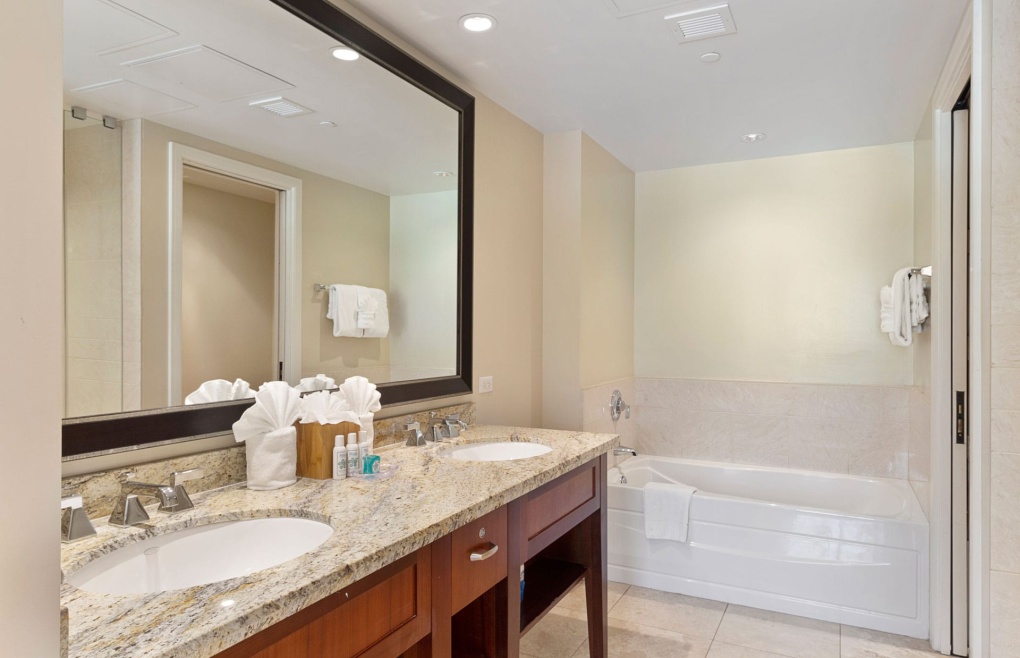 First bathroom has a double granite vanity